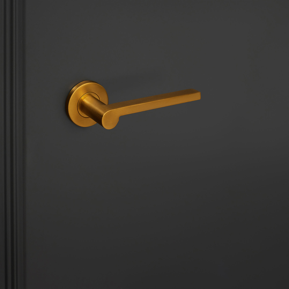 Caserta_goud_rond_rozet_zwarte_deur