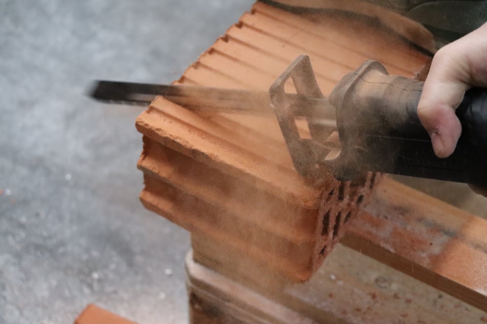 Reciprozaagvoorbetonensteen