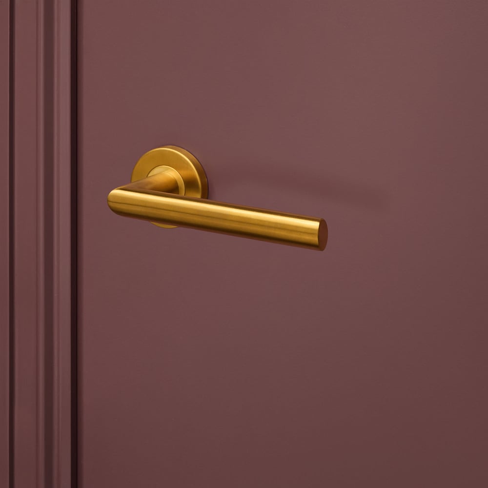 Ragusa_goud_rond_rozet_bordeaux_deur